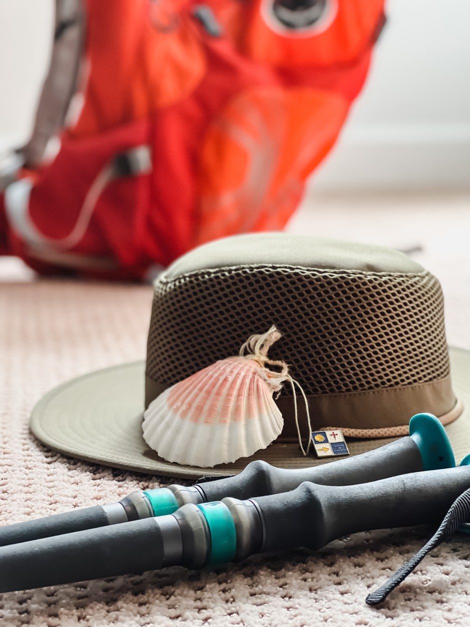 Hat, shell, bag, boots, and hiking poles.